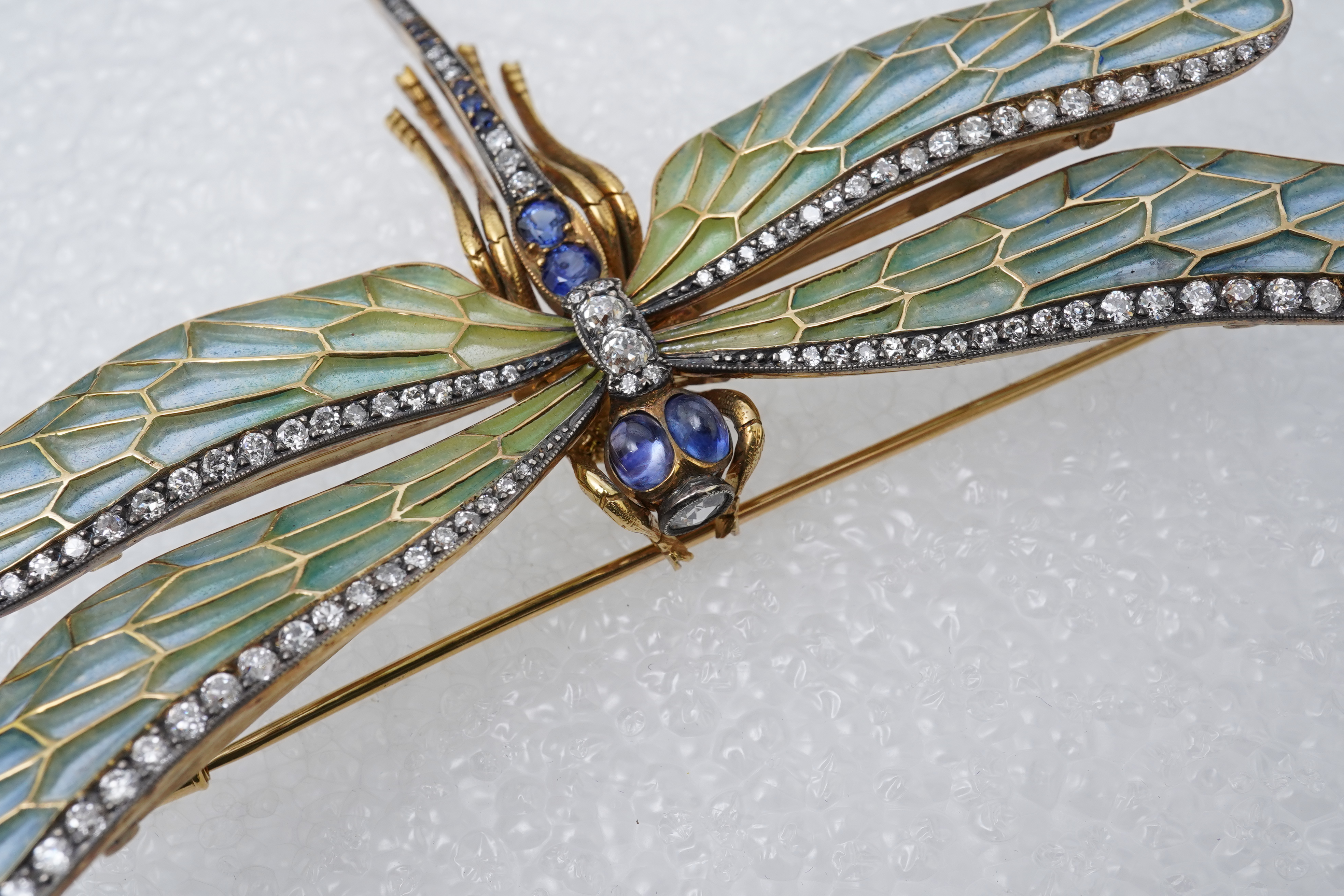An enamel, sapphire and diamond dragonfly brooch